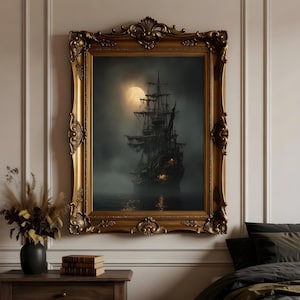 May include: A framed artwork depicting a ghostly ship sailing on dark waters under a full moon. The ornate gold frame surrounds the eerie scene, creating a vintage aesthetic. The artwork evokes a sense of mystery and adventure.