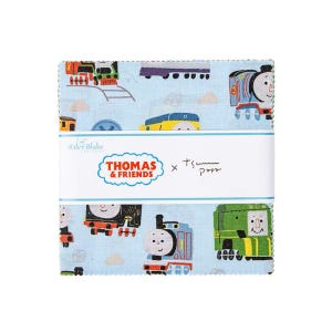 May include: A stack of light blue fabric squares featuring colorful illustrations of Thomas the Tank Engine and friends. The fabric is branded with "Thomas & Friends" and "Riley Blake" logos.