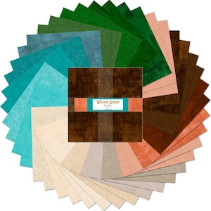 May include: A circular arrangement of fabric squares in various colors, including teal, green, brown, and beige. The center features a bundle of fabric with the text "Western Sunset". These fabric squares are likely for quilting or other craft projects.