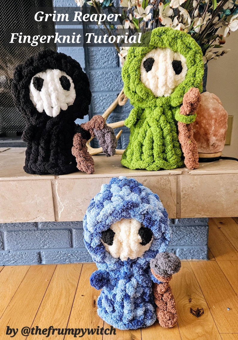 May include: Three finger-knitted Grim Reaper figures in black, green, and blue. Each figure has a white skull face with black eye sockets and holds a brown scythe. The figures are displayed on a stone shelf with the text "Grim Reaper Fingerknit Tutorial".