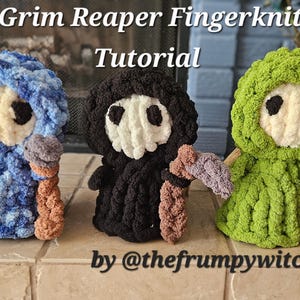 May include: Three finger-knitted Grim Reaper figures in blue, black, and green. Each figure has a white face, black eye holes, and a scythe. The text "Grim Reaper Fingerknit Tutorial" is at the top, and "by @thefrumpywitch" is at the bottom.