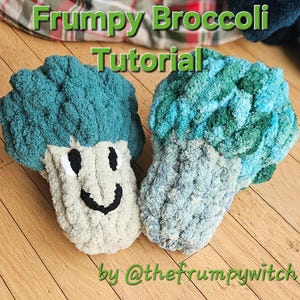 May include: Two crocheted broccoli plushies, one green and one blue, with smiling faces. The plushies are on a wooden surface. The text "Frumpy Broccoli Tutorial by @thefrumpywitch" is at the top of the image.