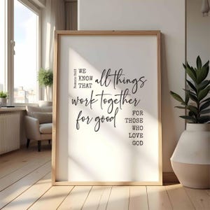 May include: A framed print with a white background and black text. The text reads "Romans 8:28 We know that all things work together for good for those who love God."