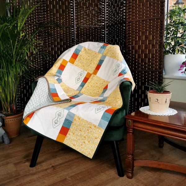 Patchwork quilted blanket, ditsy floral in yellow, orange and blue fabric, cosy lap quilt, sofa throw, soft blanket