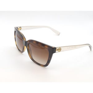 May include: Tortoise shell sunglasses with brown gradient lenses and gold accents. The sunglasses have a clear plastic frame.