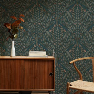 May include: A teal green wallpaper with a repeating pattern of brown leafy branches and small pink flowers. The wallpaper is in a room with a wooden cabinet and a chair.