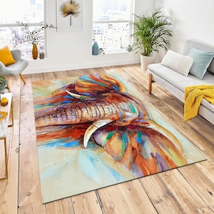 May include: A colorful watercolor painting of an elephant's face. The elephant's trunk is raised and its eyes are closed. The painting is done in shades of orange, red, blue, green, and purple.