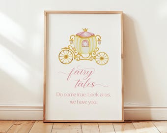 May include: A white framed print with a gold and pink carriage illustration and the text "fairy tales Do come true. Look at us, we have you."