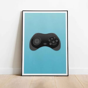 May include: A black Sega Genesis controller on a light blue background. The controller has a gray start button and a gray select button.