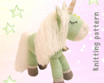 May include: Knitting pattern for a green unicorn with a white mane and tail. The unicorn has a yellow horn and closed eyes. The pattern is written on a pink background with white stars.