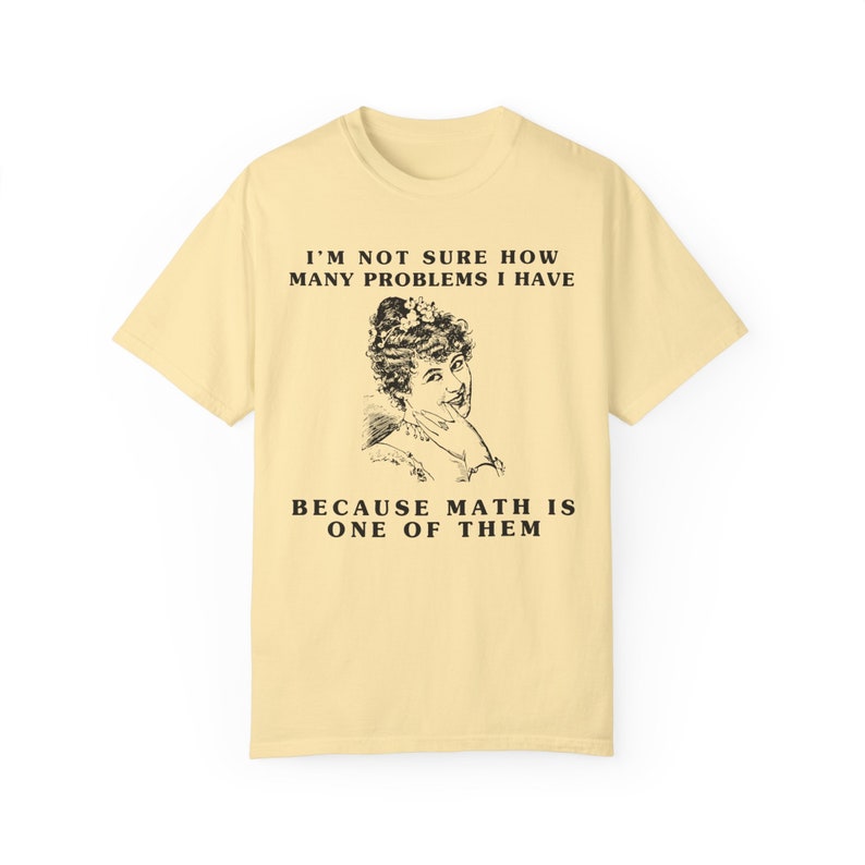 model is wearing Comfort Colors oversized tee shirt in banana (light yellow) with girl math graphic on front