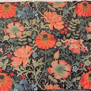 May include: Fabric with a floral pattern featuring large orange flowers with black centers, green leaves, and blue accents on a dark background. The design includes swirling vines and smaller red and blue flowers.