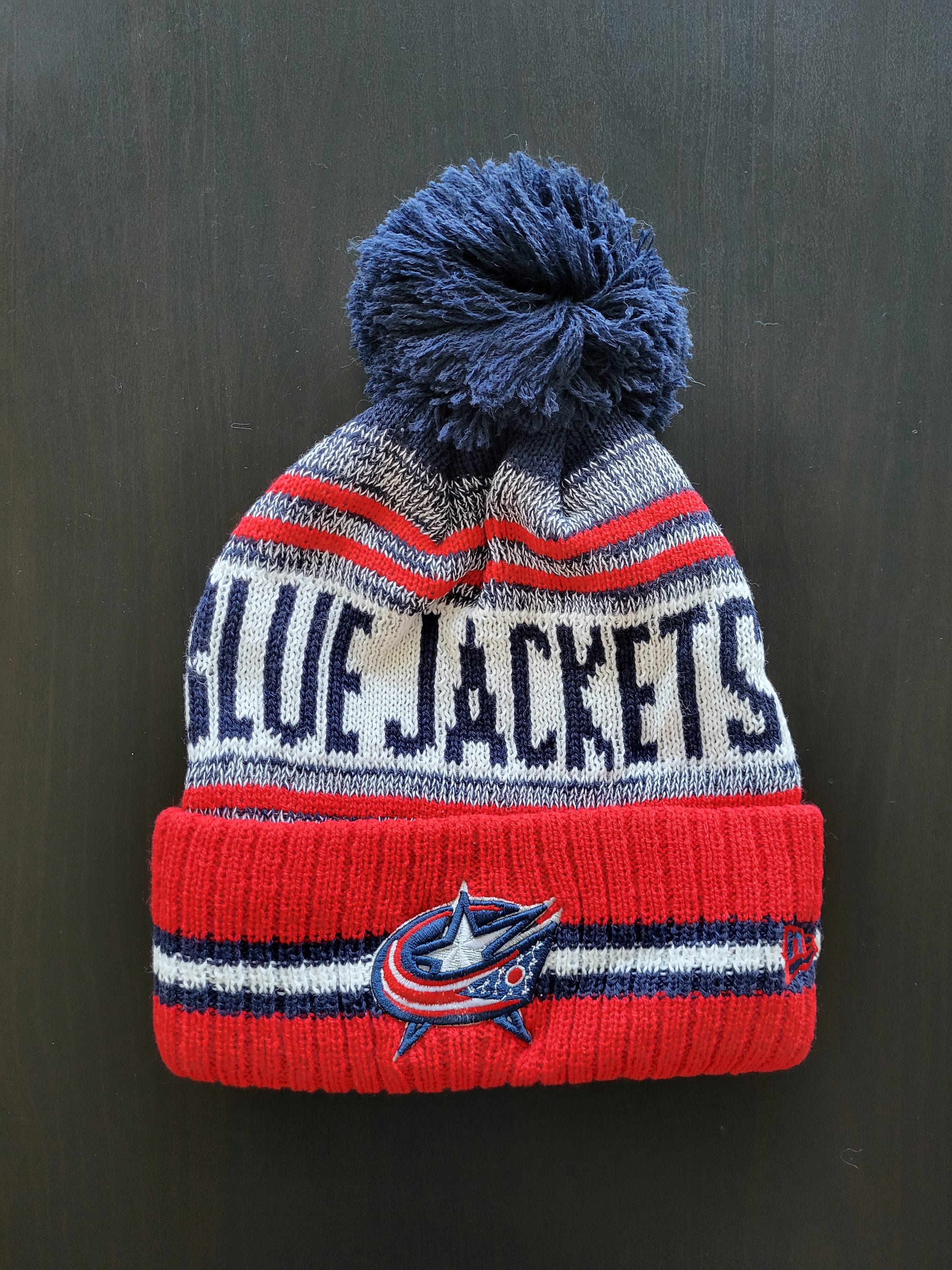 Columbus Blue Jackets NHL Winter Hockey Beanie Hat With Fuzzy Pom Red Blue White With Embroidered Logo Patch Warm Knit Cotton Acrylic Columbus Blue Jackets NHL Winter Hockey Beanie Hat With Fuzzy Pom Red Blue White With Embroidered Logo Patch Warm Knit Cotton Acrylic