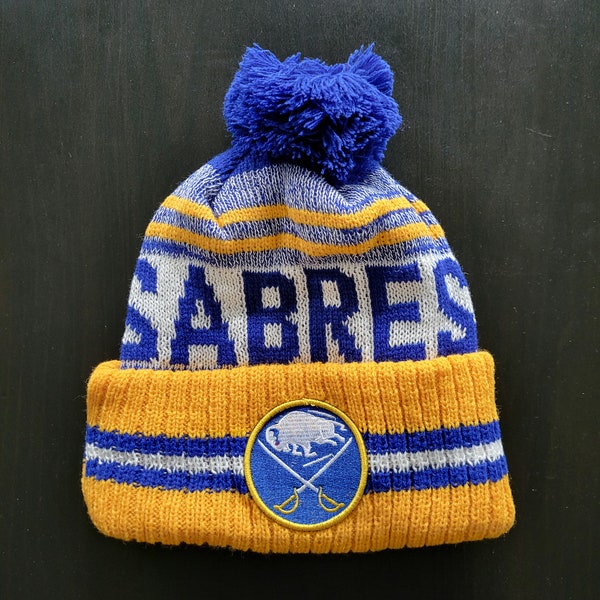 Buffalo Sabres NHL Winter Hockey Beanie Hat With Fuzzy Pom Blue Yellow White With Embroidered Logo Patch Warm Knit Cotton Acrylic