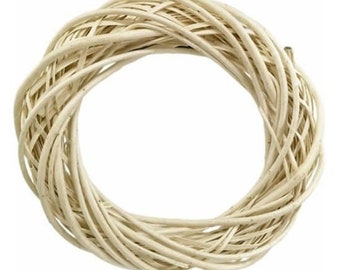 May include: A white wicker wreath, perfect for crafting and decorating.
