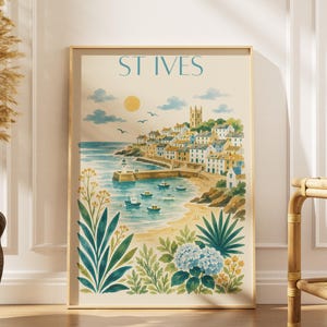 May include: A framed vertical art print featuring a coastal scene of St Ives with a harbor, small boats, a sandy beach, and a town on a hillside. The illustration includes a yellow sun, blue sky with clouds, and foreground foliage with blue flowers.