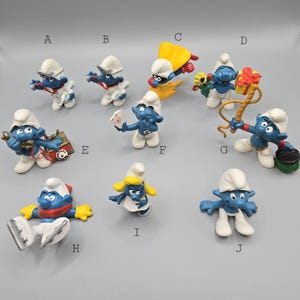 Retro Smurf Figurines from the 1970s and 1980s. Ideal for Nostalgia Lovers of the Blue Cartoon Collectibles.