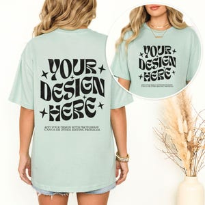 May include: A light green t-shirt with the text "YOUR DESIGN HERE" in black, with star accents. The back of the shirt also features the same text. The bottom of the shirt reads "ADD YOUR DESIGN WITH PHOTOSHOP, CANVA OR OTHER EDITING PROGRAM."