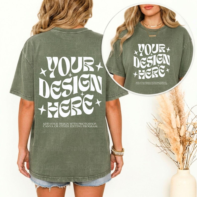 May include: Olive green t-shirt with the text "YOUR DESIGN HERE" in white, with star accents. The text "ADD YOUR DESIGN WITH PHOTOSHOP, CANVA OR OTHER EDITING PROGRAM" is below the main text. The shirt is worn with denim shorts.