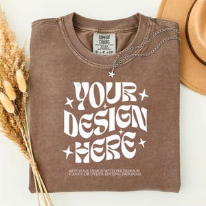 May include: A white ceramic mug with a black handle and the text "But First, Coffee" in a bold, black font. The mug is sitting on a wooden surface. The mug is approximately 4 inches tall.