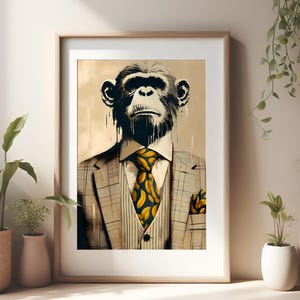 May include: A framed wall art print featuring a chimpanzee wearing a tan plaid suit, a white collared shirt, and a dark blue necktie with a yellow banana pattern. The chimpanzee has dark fur with paint-like drips, and a matching pocket square.