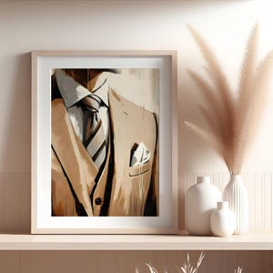 May include: A framed painting of a brown suit jacket with a white shirt and a striped tie. The painting is in a light brown frame and is hanging on a wall.
