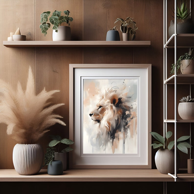 May include: A framed watercolor painting of a lion's head in profile, with a soft, muted color palette of beige, brown, and gray. The lion's mane is flowing and the background is a light wash of color.