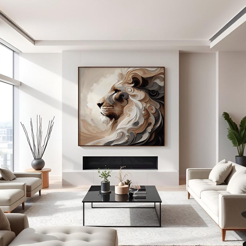 May include: Large framed canvas art featuring a profile of a lion's head. The artwork uses a palette of beige, brown, and gray tones. The lion's mane is depicted with swirling, textured details. The artwork is displayed above a fireplace in a modern living room.