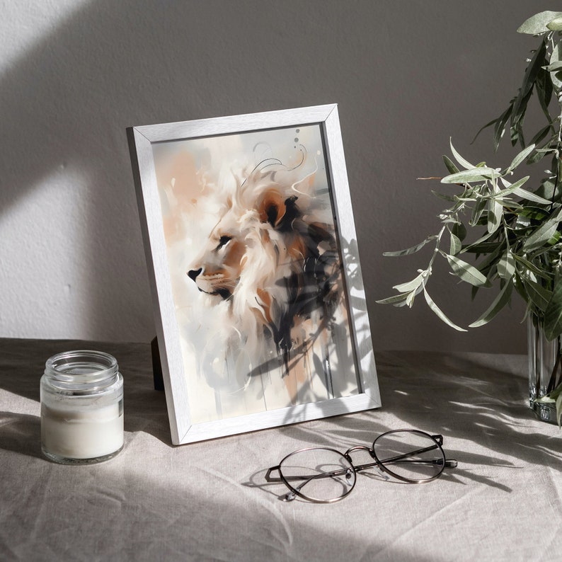 May include: A framed watercolor painting of a lion's head in shades of brown, white, and gray. The lion is looking to the left, and the background is a soft, abstract wash of color.
