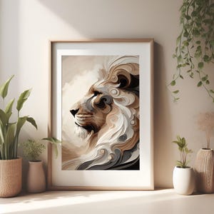 May include: Framed art print featuring a profile of a lion's head with a flowing mane. The artwork uses a palette of beige, brown, and gray tones, creating a textured, artistic effect. The print is displayed in a light wooden frame, suitable for home decor.