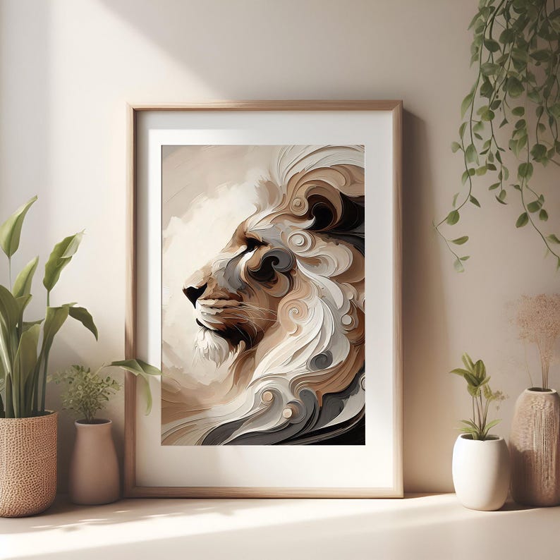 May include: Framed art print featuring a profile of a lion's head with a flowing mane. The artwork uses a palette of beige, brown, and gray tones, creating a textured, artistic effect. The print is displayed in a light wooden frame, suitable for home decor.