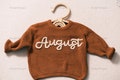 Bespoke Baby jumper: Hand-Embroidered Name & Monogram - A Treasured Gift from Auntie to Your Little One product logo