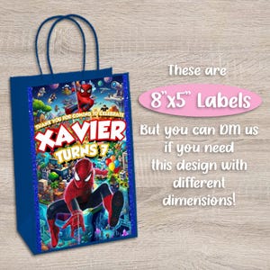May include: A dark blue gift bag featuring a Spider-Man graphic with the text "XAVIER TURNS 7" and "THANK YOU FOR COMING TO CELEBRATE". Next to the bag, pink text states "These are 8x5" Labels" and "But you can DM us if you need this design with different dimensions!"
