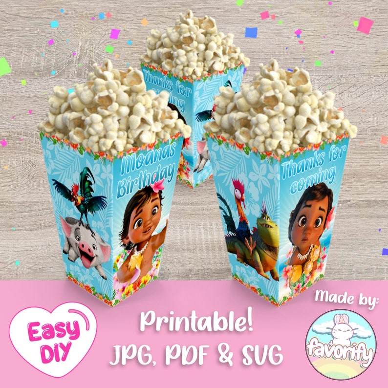 May include: Printable Moana themed popcorn boxes with blue, green, and white designs. The boxes feature Moana, Maui, and Pua. The text on the boxes reads "Moana's Birthday" and "Thanks for coming".