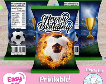 May include: Printable soccer-themed chip bag wrapper design with a green and blue background. The design features a soccer ball with flames, a trophy, and the text "Happy Birthday".