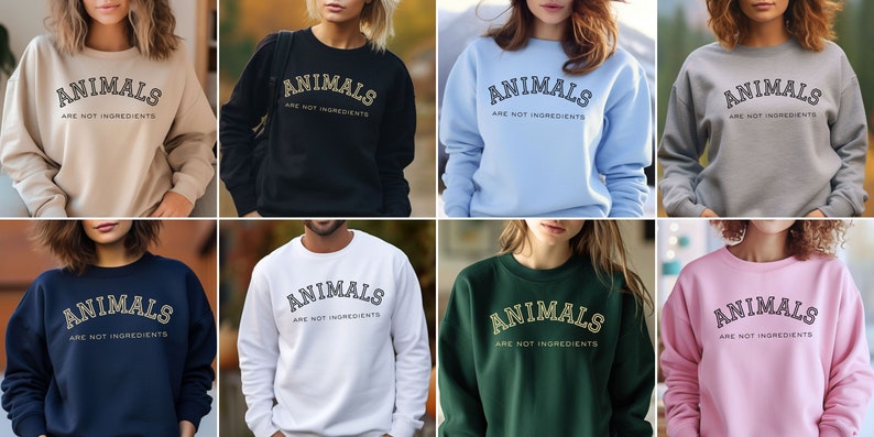 May include: A collection of eight crewneck sweatshirts in various colors, each displaying the text "ANIMALS ARE NOT INGREDIENTS" in a collegiate-style font. The sweatshirts are in shades of beige, black, light blue, gray, navy, white, green, and pink.