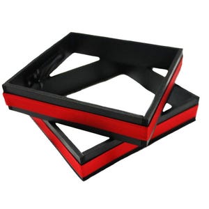 May include: Two black square-shaped frames with red trim. The frames are stacked on top of each other.
