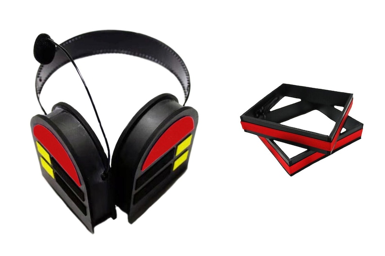 May include: Black noise-cancelling headphones with red and yellow accents. The headphones are folded and have a microphone attached to the left earcup.