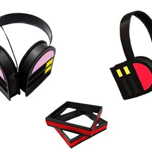 May include: Two pairs of black headphones with colourful geometric designs on the earcups. One pair has pink, yellow, and black designs, and the other pair has red, yellow, and black designs.