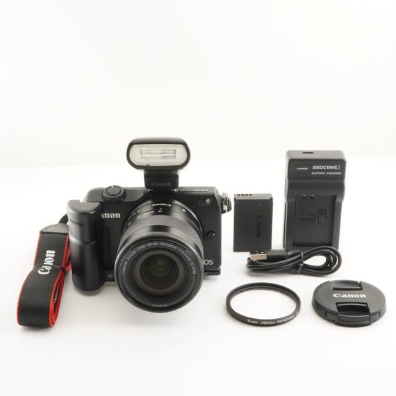 Canon EOS M2 Black + EF-M 18-55mm is Stm + Speedlite 90ex Canon EOS M2 Black + EF-M 18-55mm is Stm + Speedlite 90ex
