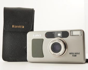 Lot De 2 Appareils Photo Argentiques Canon Et Konica Autoreflex + Accessoires (non Testés)