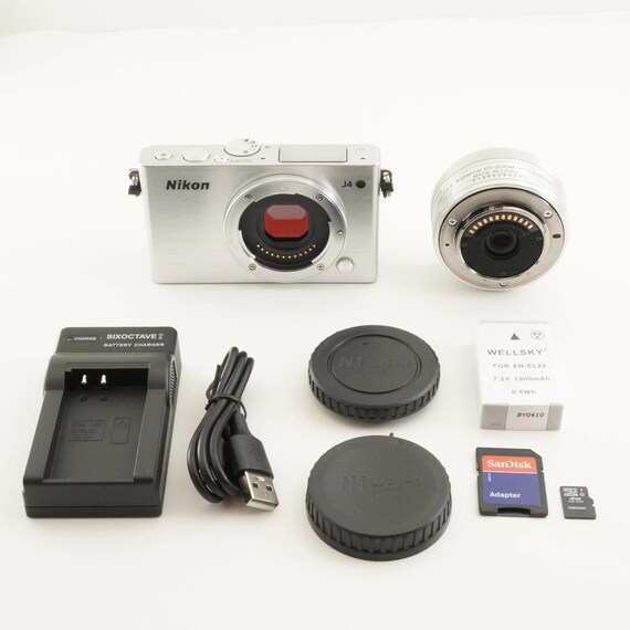Nikon 1 J4 Silver [3,599 Shots] + 1 NIKKOR 10-30mm + 4GB Microsd