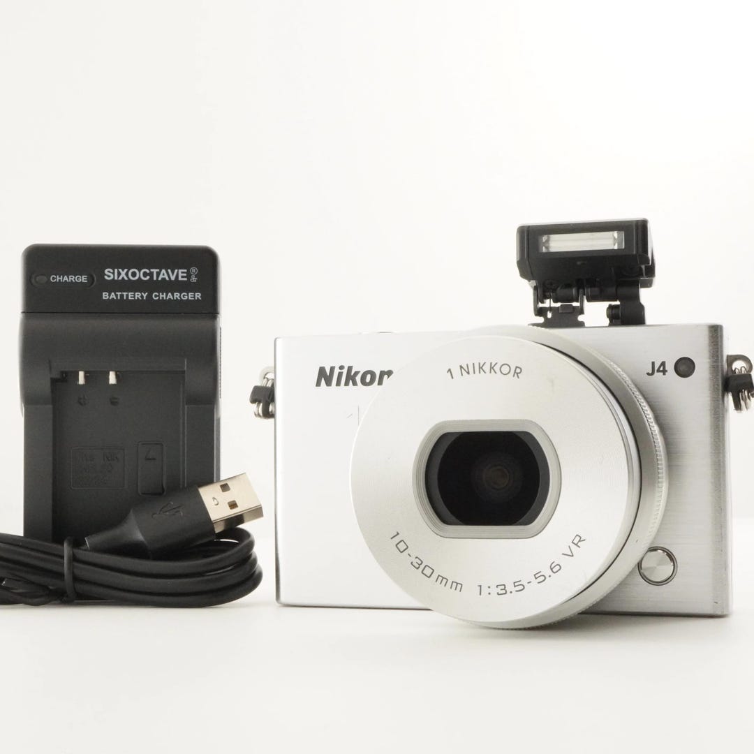 Nikon 1 J4 Silver [3,599 Shots] + 1 NIKKOR 10-30mm 4GB Microsd