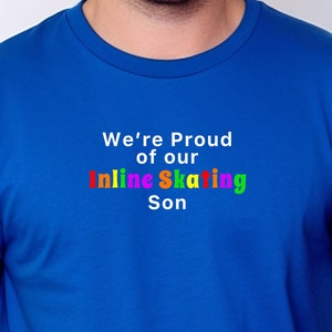 May include: A royal blue t-shirt with the text "We're Proud of our Inline Skating Son" in white and rainbow colours.