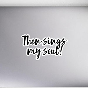 May include: A white laptop with a black sticker that says "Then sings my soul!"