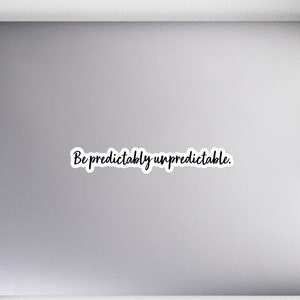 May include: A white laptop with a black sticker that says "Be predictably unpredictable."