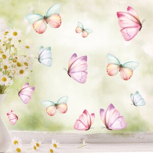 May include: A set of 10 colourful butterfly decals in shades of pink, blue, and green. The butterflies are arranged in a random pattern on a light green background.