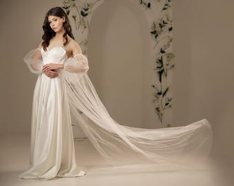 Bridal cape with sleeves