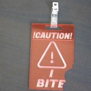 Caution I Bite - Transparent Laser Cut Acrylic Furry Badge - Fursuit Cosplay Accessory