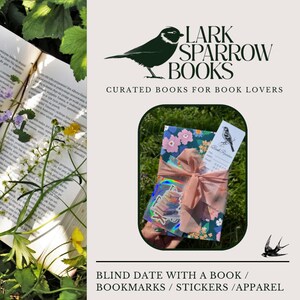 May include: A book wrapped in pink and green floral patterned paper with a pink ribbon. The book is labeled "Blind Date with a Book" and is accompanied by a bookmark and a sticker. The text "Lark Sparrow Books" is displayed above the book.